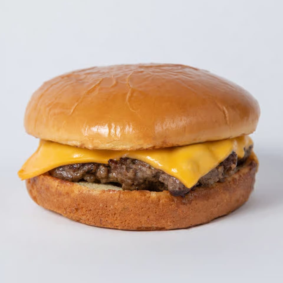 A classic cheeseburger with two patties and melted cheese on a toasted bun.